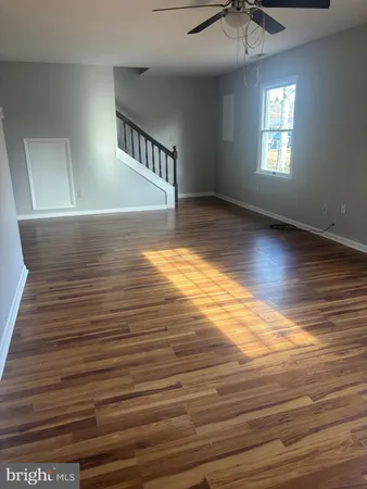 a view of room window and wooden floor