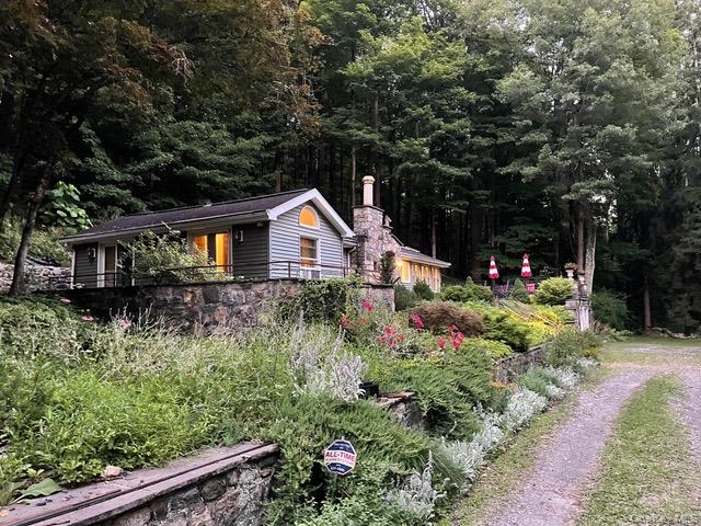 46 Gallows Hill Road Cortlandt Manor, NY 10567 - Photo 2 of 11 a front view of a house with a yard and tree s