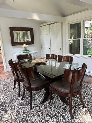 a view of a dining room with furniture