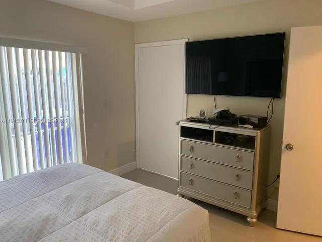 a view of a porch with wooden floor and stairs