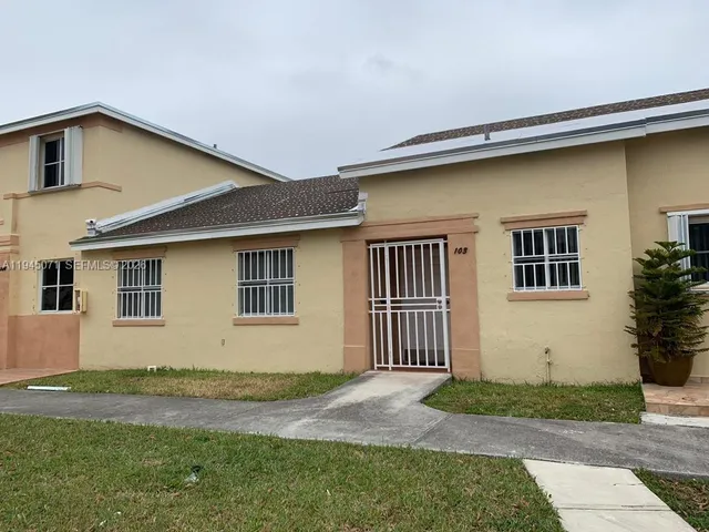 a bedroom with a bed and a cabinet