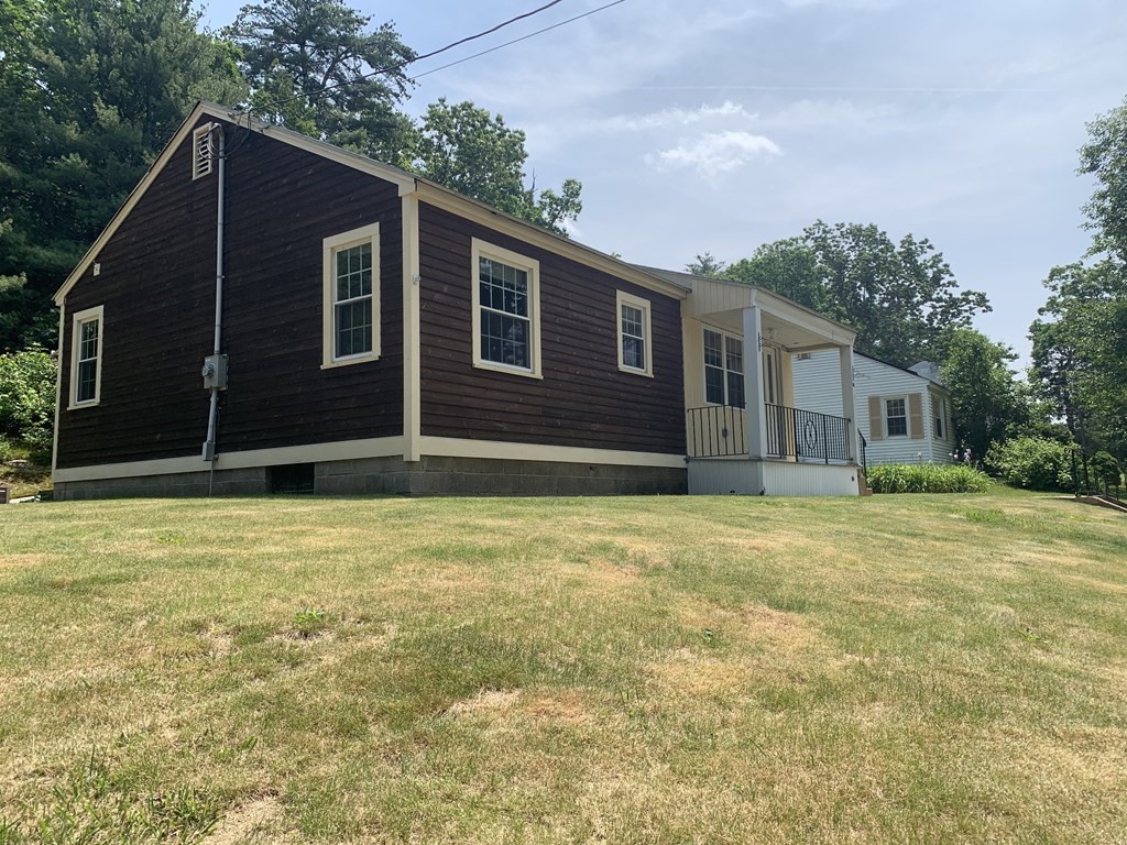 46 New Boston Road Sturbridge, MA 01566 - Photo 1 of 14 a house with a yard