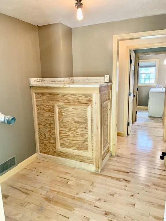46 New Boston Road Sturbridge, MA 01566 - Photo 11 of 14 a view of an empty room with wooden floor and a bathroom