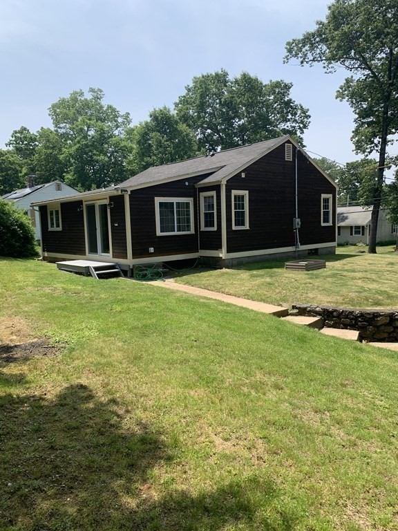 46 New Boston Road Sturbridge, MA 01566 - Photo 13 of 14 a view of a house with a yard