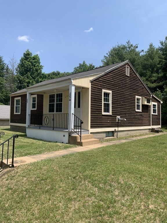 46 New Boston Road Sturbridge, MA 01566 - Photo 14 of 14 a backyard of a house with table and chairs