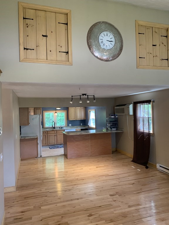 46 New Boston Road Sturbridge, MA 01566 - Photo 2 of 14 a view of kitchen and kitchen with wooden floor