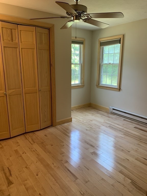 46 New Boston Road Sturbridge, MA 01566 - Photo 8 of 14 a view of an empty room with wooden floor and a window