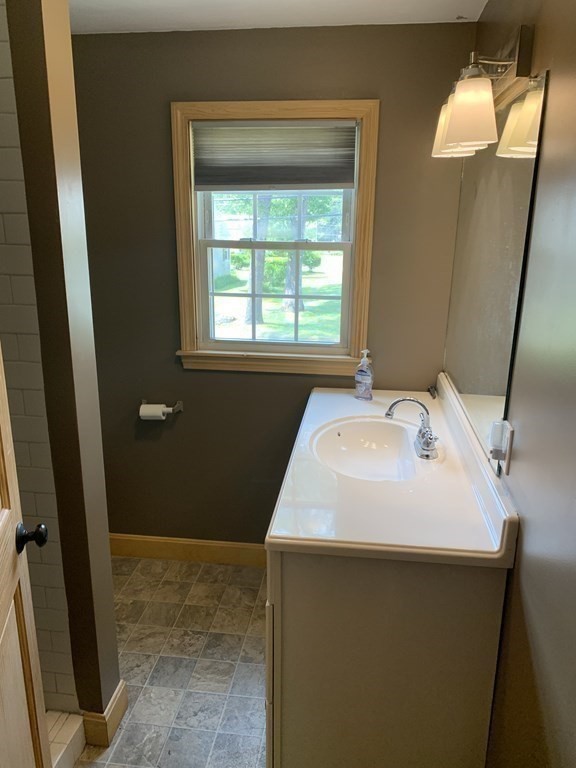 46 New Boston Road Sturbridge, MA 01566 - Photo 10 of 14 a bathroom with a sink and a mirror