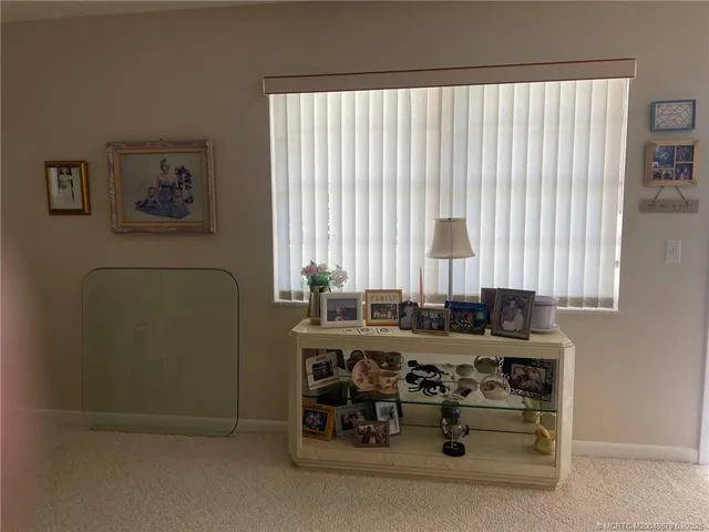 a view of a dining room with furniture and window