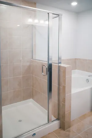 a bathroom with a bathtub and a shower