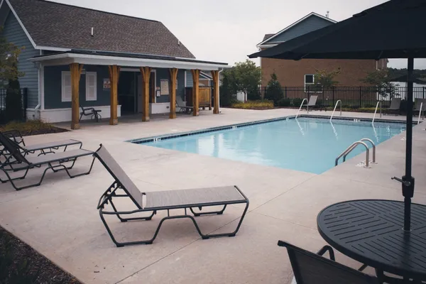 a view of a chairs and table in the patio