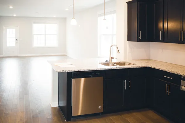 a kitchen with a sink and a mirror
