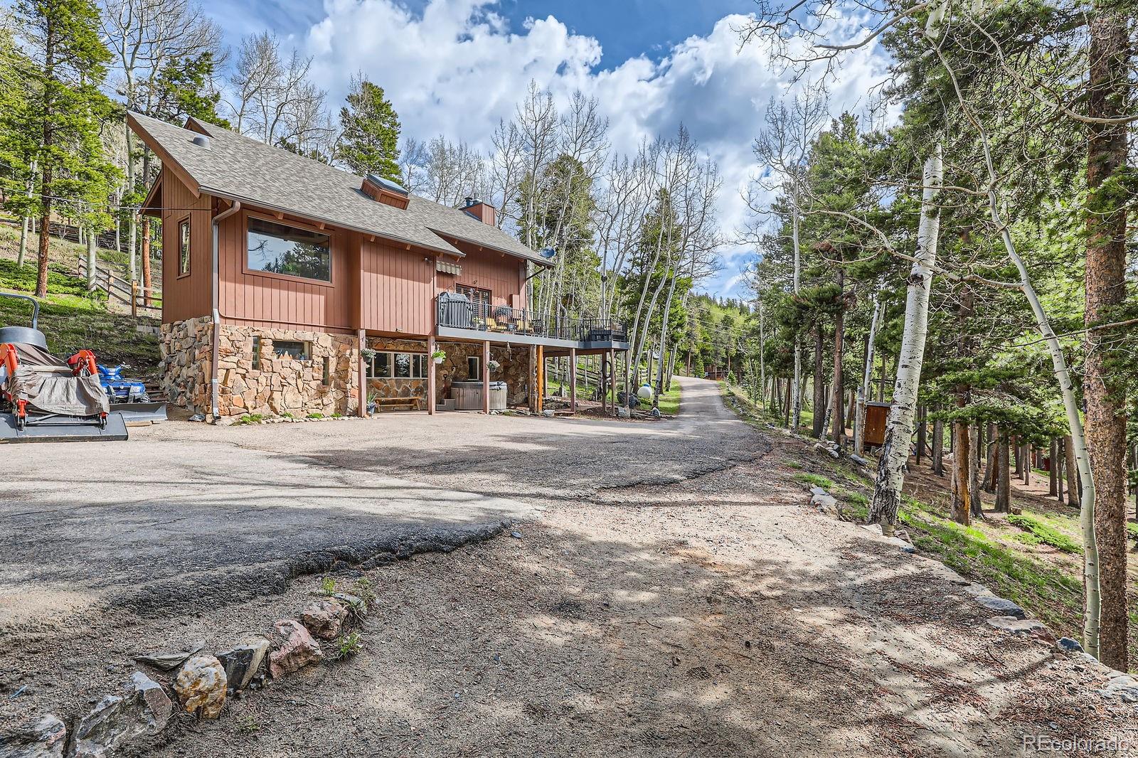 266 Lodgepole Drive Evergreen, CO 80439 - Photo 1 of 45 a pathway of a house with a yard