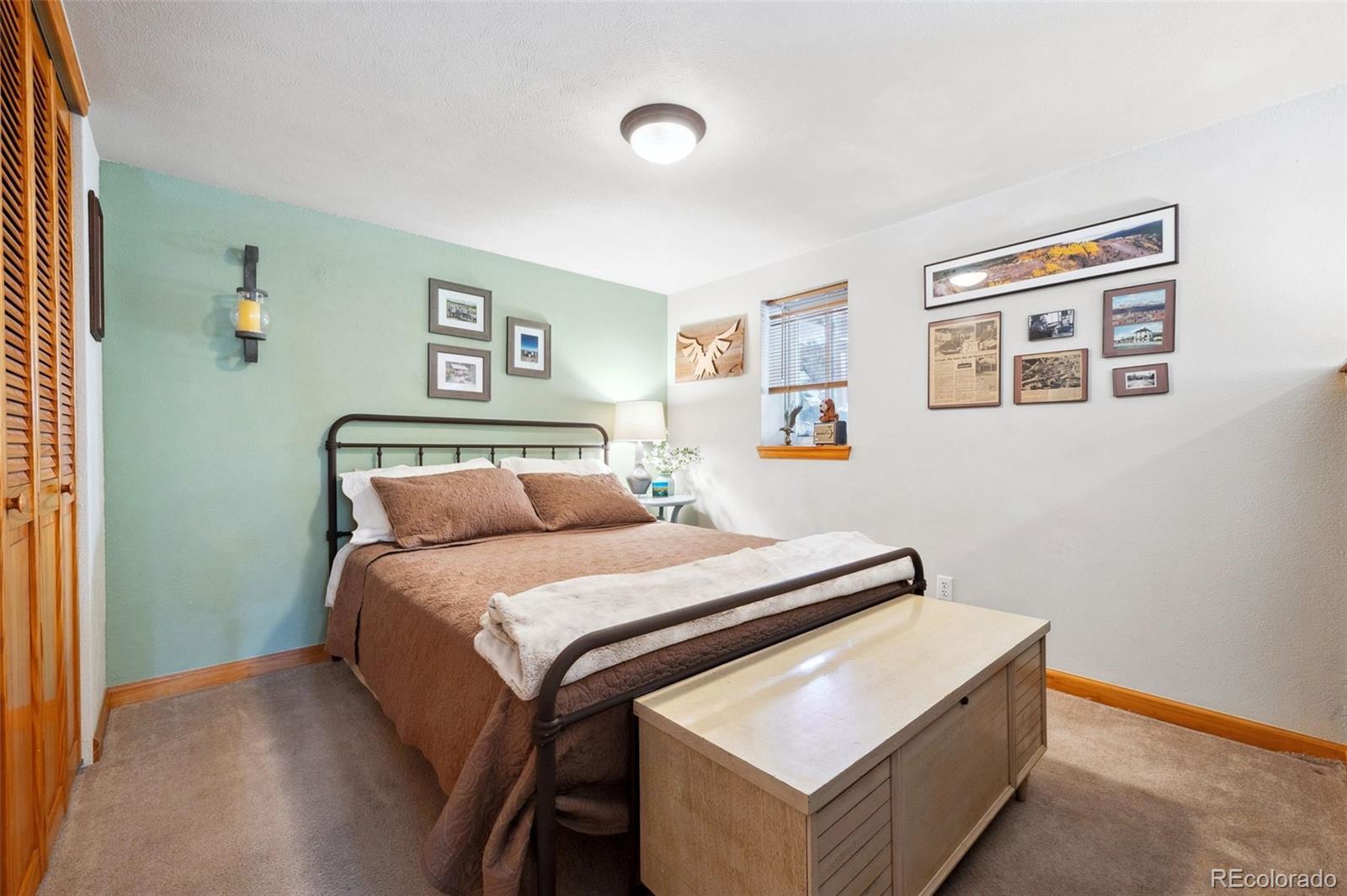 266 Lodgepole Drive Evergreen, CO 80439 - Photo 31 of 45 a bed room with a bed and a couch