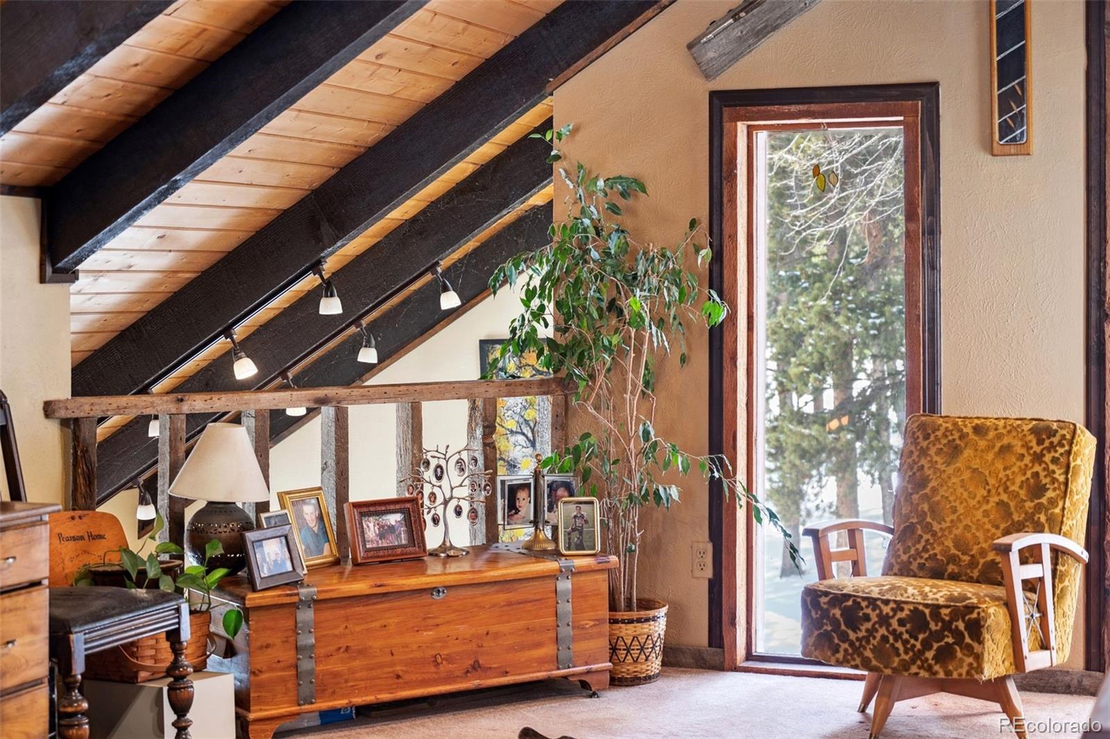 266 Lodgepole Drive Evergreen, CO 80439 - Photo 32 of 45 a view of balcony with furniture and garden
