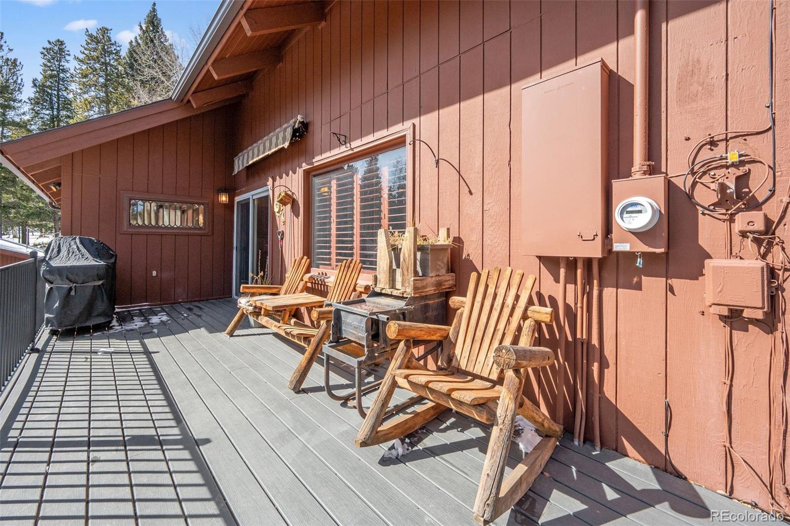 266 Lodgepole Drive Evergreen, CO 80439 - Photo 34 of 45 a view of balcony with chairs and wooden fence