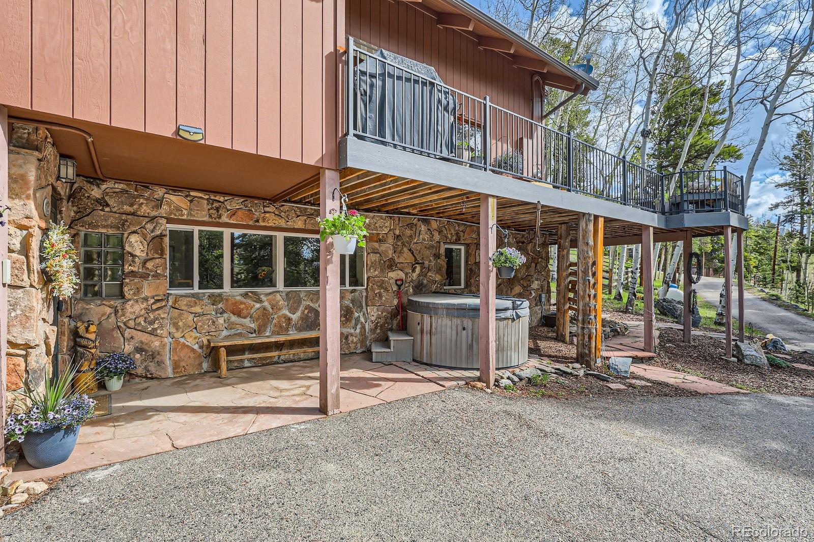 266 Lodgepole Drive Evergreen, CO 80439 - Photo 38 of 45 a view of a house with backyard