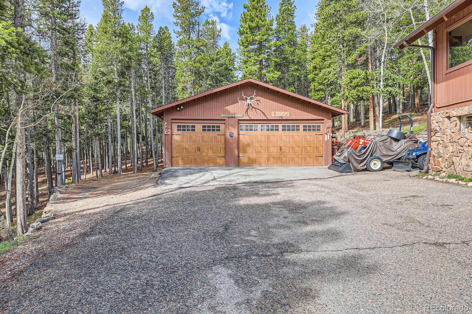 266 Lodgepole Drive Evergreen, CO 80439 - Photo 41 of 45 a view of a house with a outdoor space