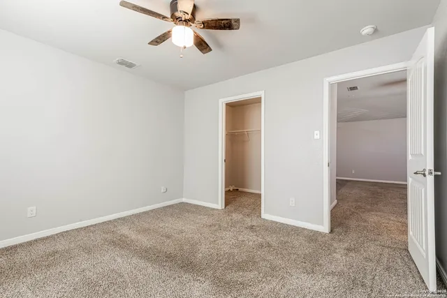 a bathroom with a tub a sink and mirror