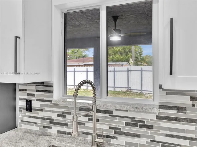 an empty room with a empty space and windows