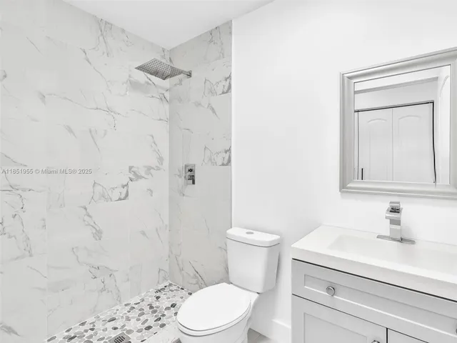 an empty room with closet area