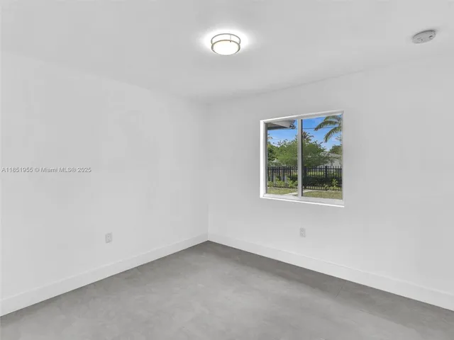 a view of a house with a yard and plants