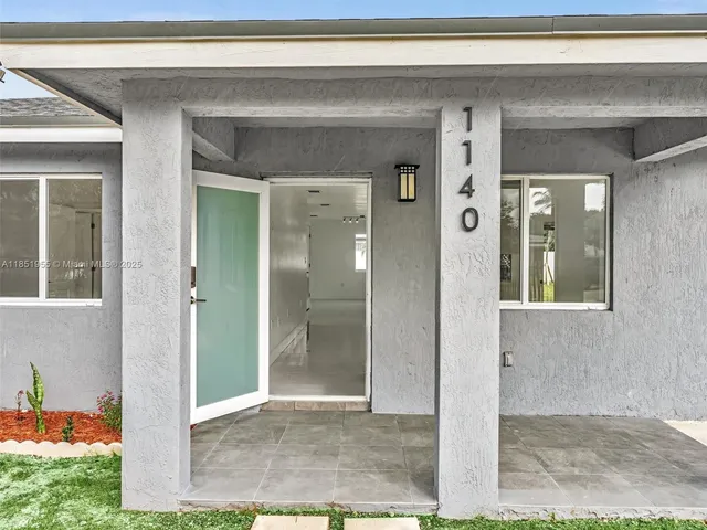 a kitchen with kitchen island granite countertop lots of counter top space and appliances