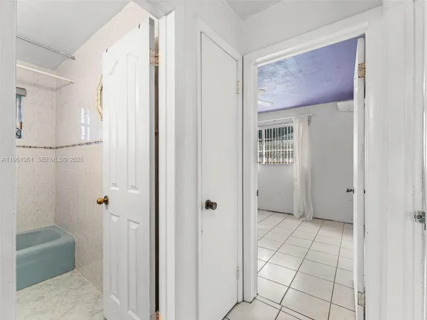 a view of an entryway with wooden floor