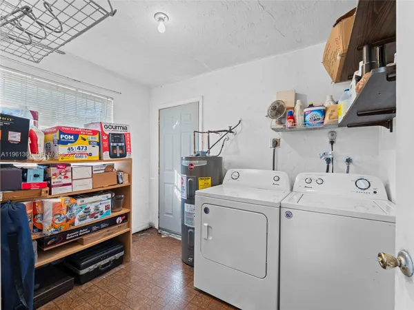 a view of a backyard with sitting area