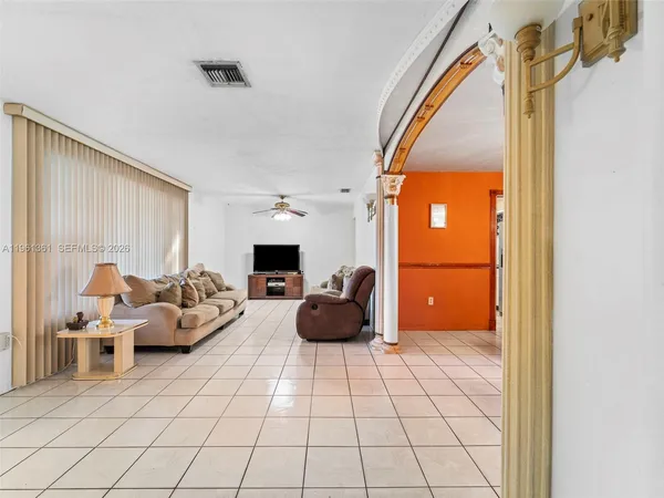 a living room with furniture and a window