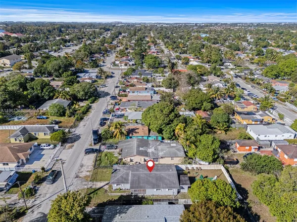 an aerial view of residential house with outdoor space
