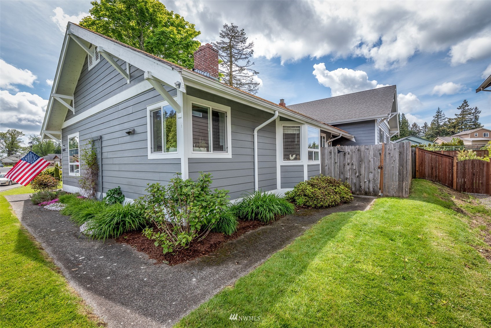 6093 Captain's Way Ferndale, WA 98248 - Photo 1 of 32 a front view of a house with garden
