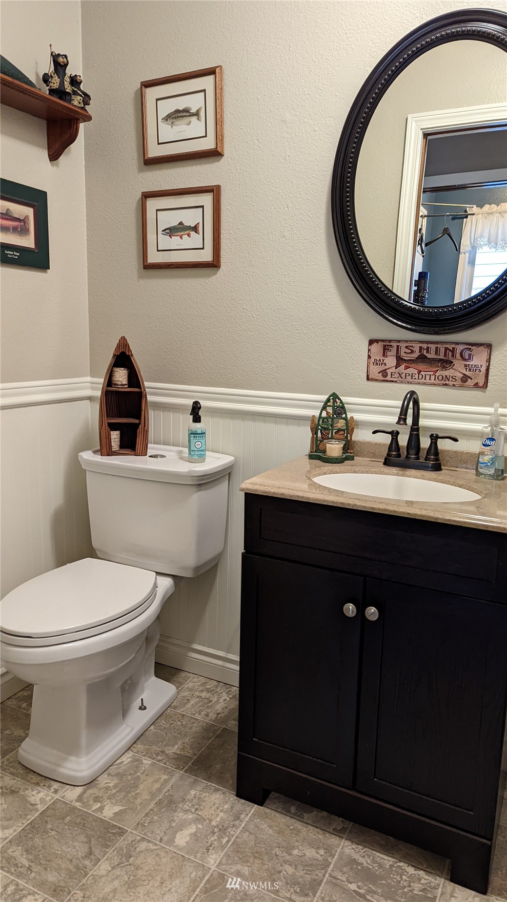 6093 Captain's Way Ferndale, WA 98248 - Photo 12 of 32 a bathroom with a toilet a sink and mirror
