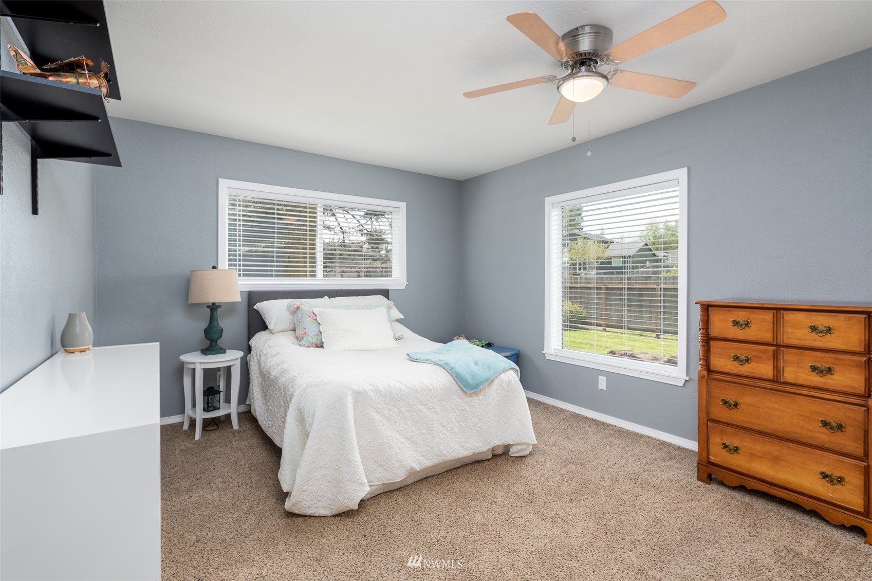 6093 Captain's Way Ferndale, WA 98248 - Photo 15 of 32 a bedroom with a bed and a window