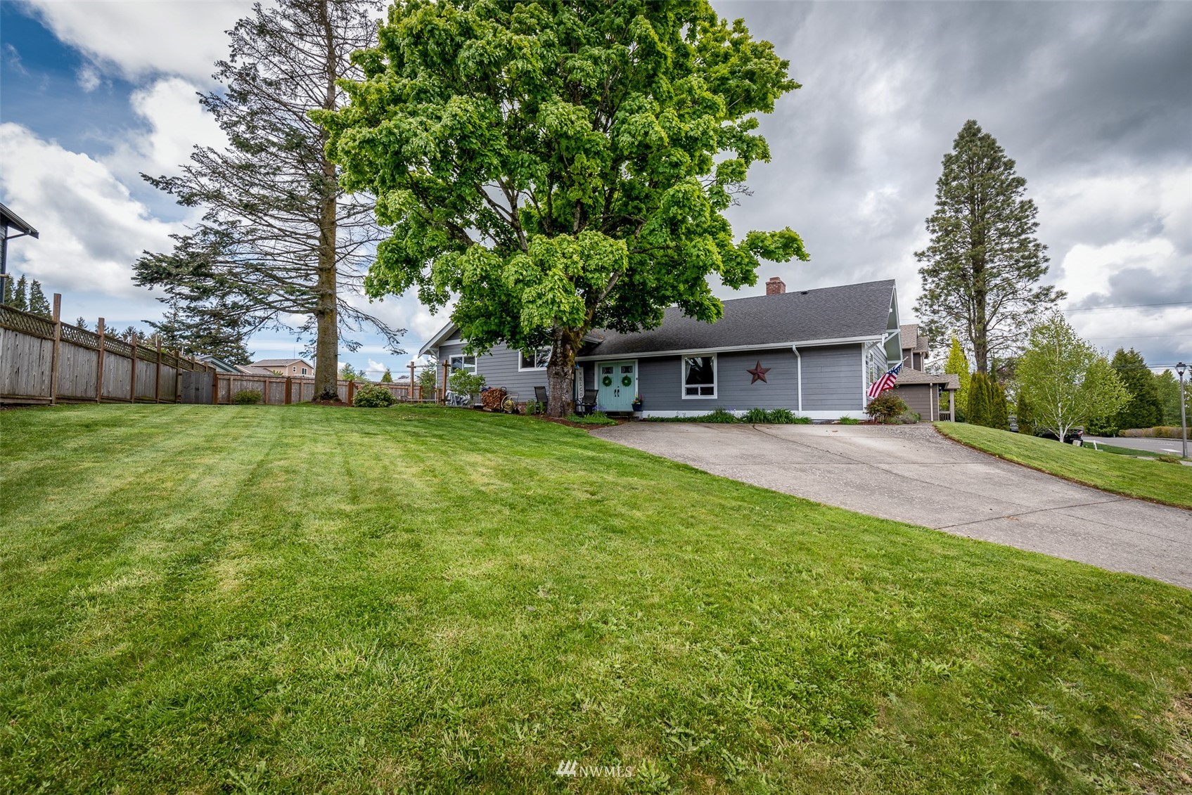 6093 Captain's Way Ferndale, WA 98248 - Photo 21 of 32 a view of house with a big yard and large trees