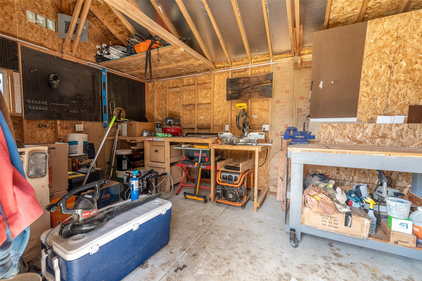 6093 Captain's Way Ferndale, WA 98248 - Photo 25 of 32 a view of a storage room with a lot of stuff
