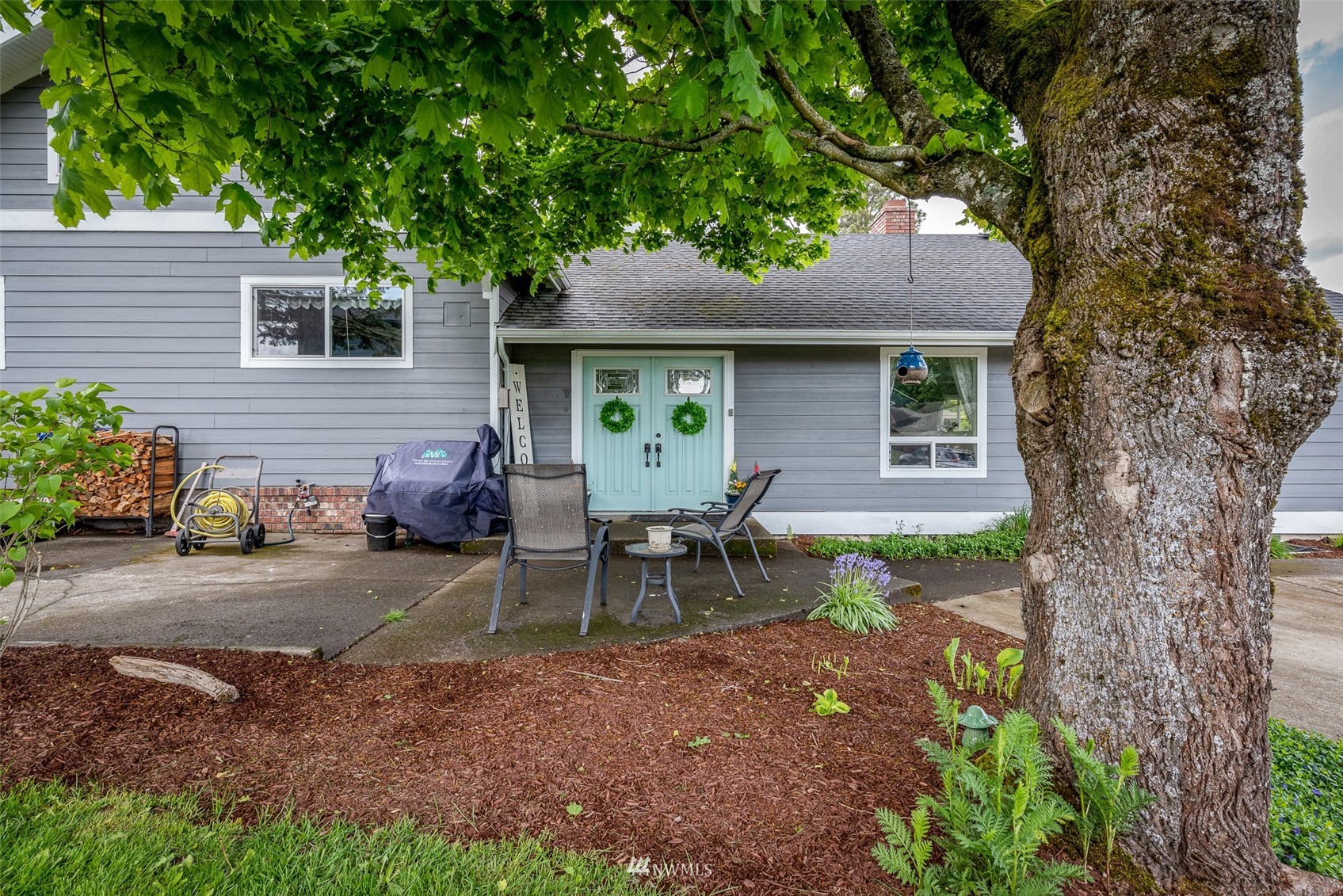 6093 Captain's Way Ferndale, WA 98248 - Photo 30 of 32 a view of a house with a chairs in a patio