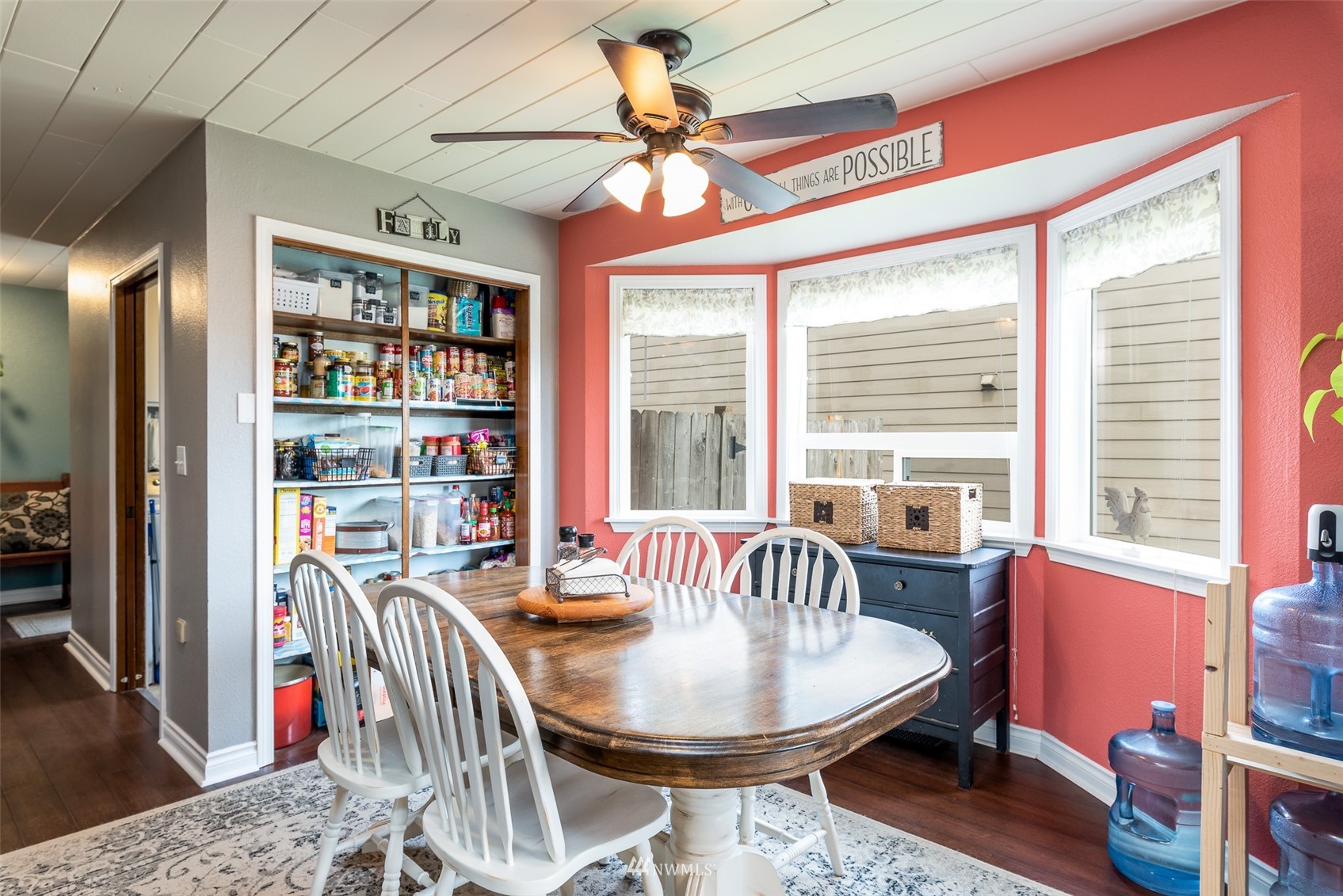 6093 Captain's Way Ferndale, WA 98248 - Photo 6 of 32 a dining room with furniture a rug and a large window