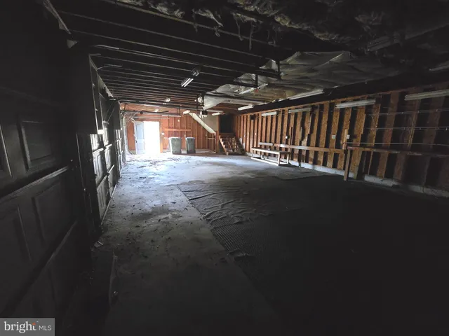 a view of an empty room with a garage