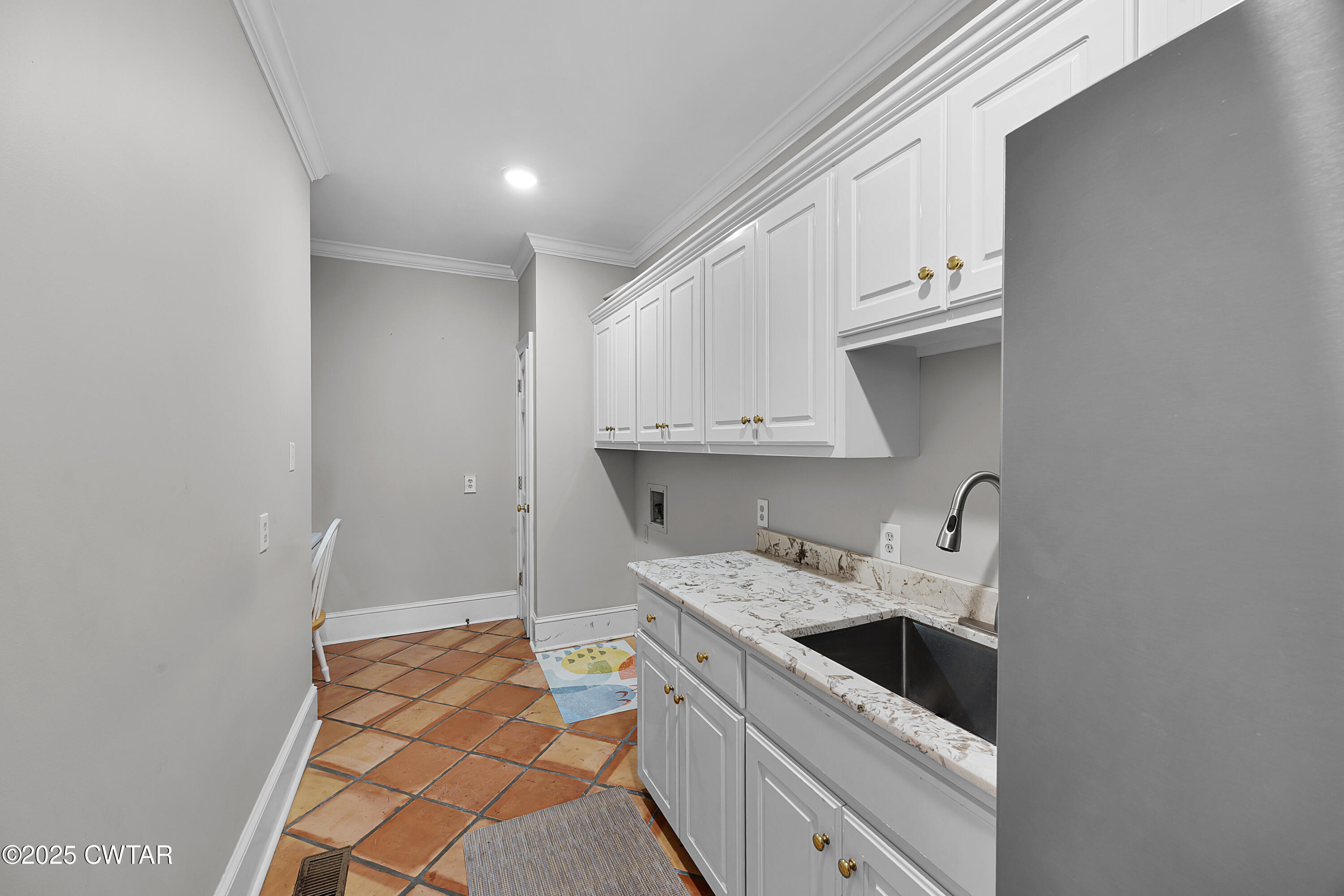 40 Winfield Place Jackson, TN 38305 - Photo 11 of 37 a kitchen with stainless steel appliances a sink stove and cabinets