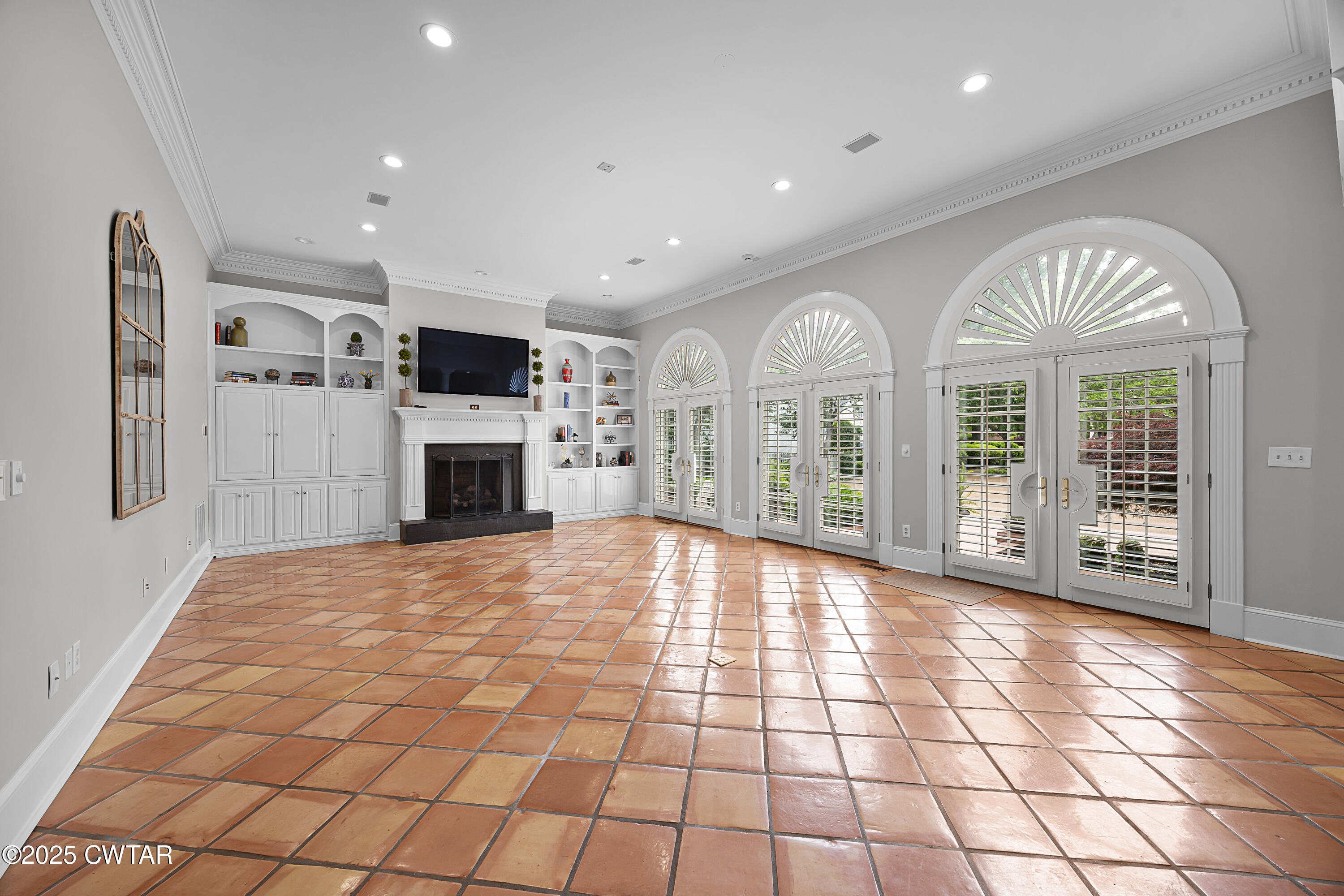 40 Winfield Place Jackson, TN 38305 - Photo 12 of 37 a view of an empty room with a fireplace and a window