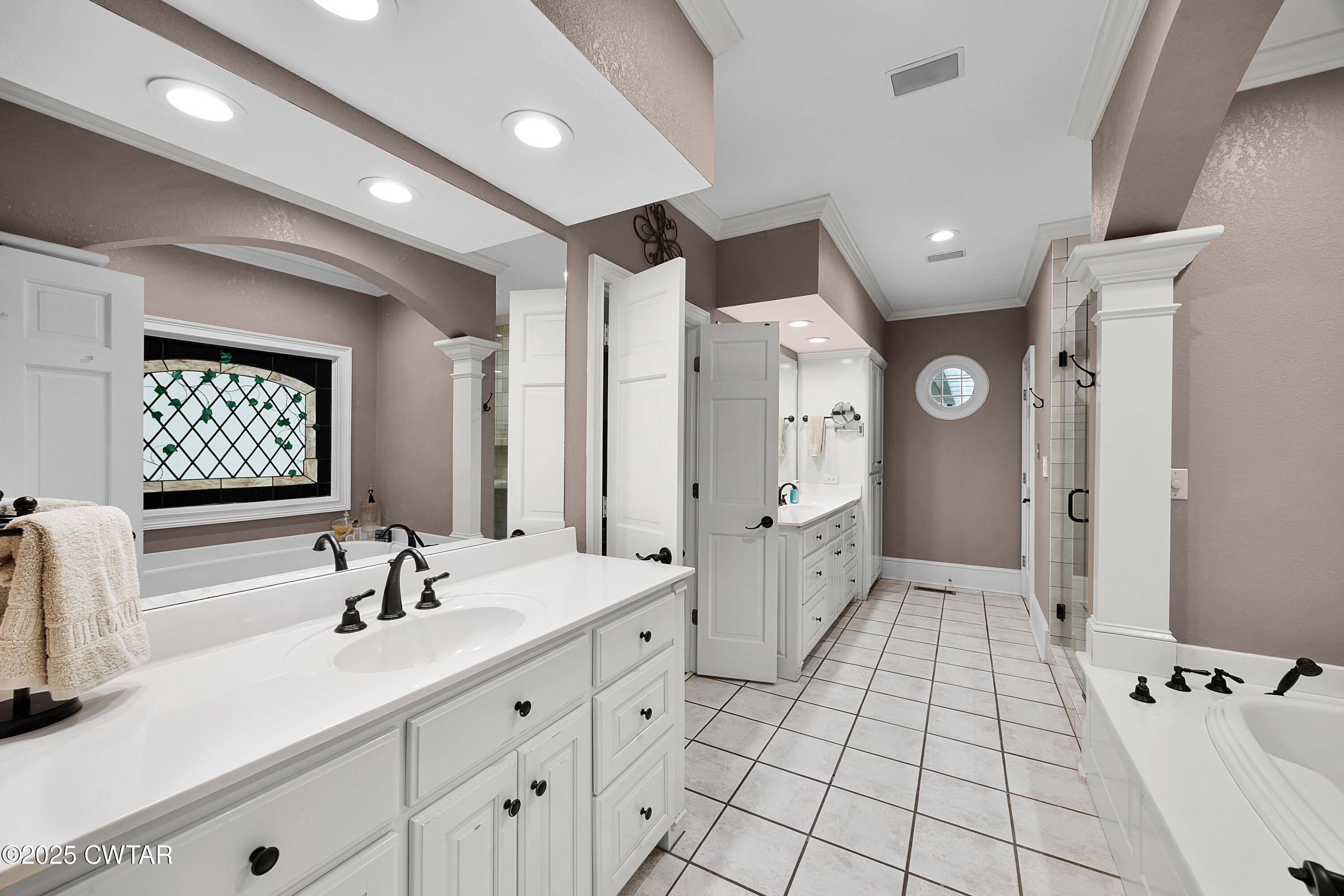 40 Winfield Place Jackson, TN 38305 - Photo 19 of 37 a spacious bathroom with a double vanity sink a mirror and a shower