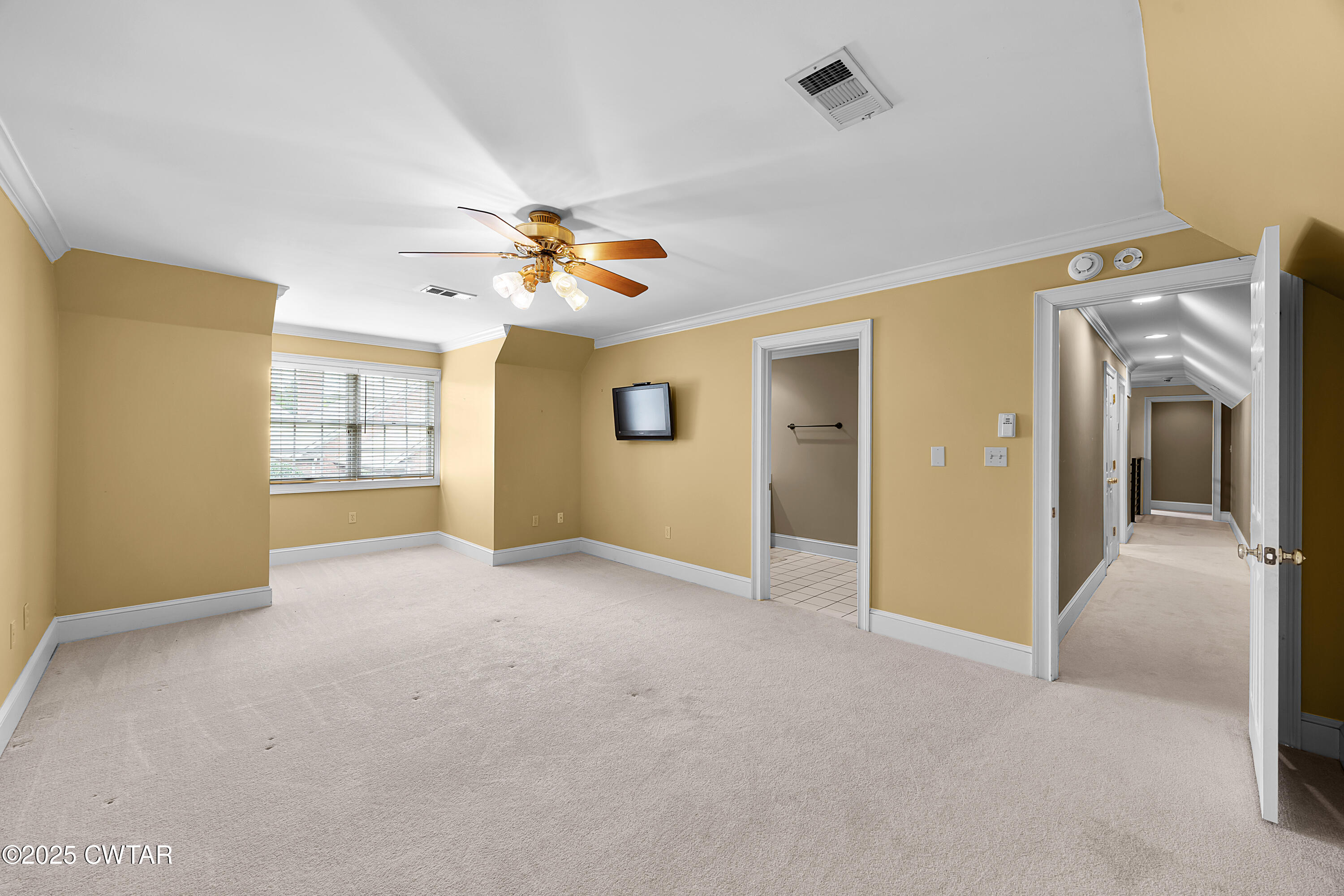 40 Winfield Place Jackson, TN 38305 - Photo 22 of 37 a view of a livingroom with a chandelier fan and windows