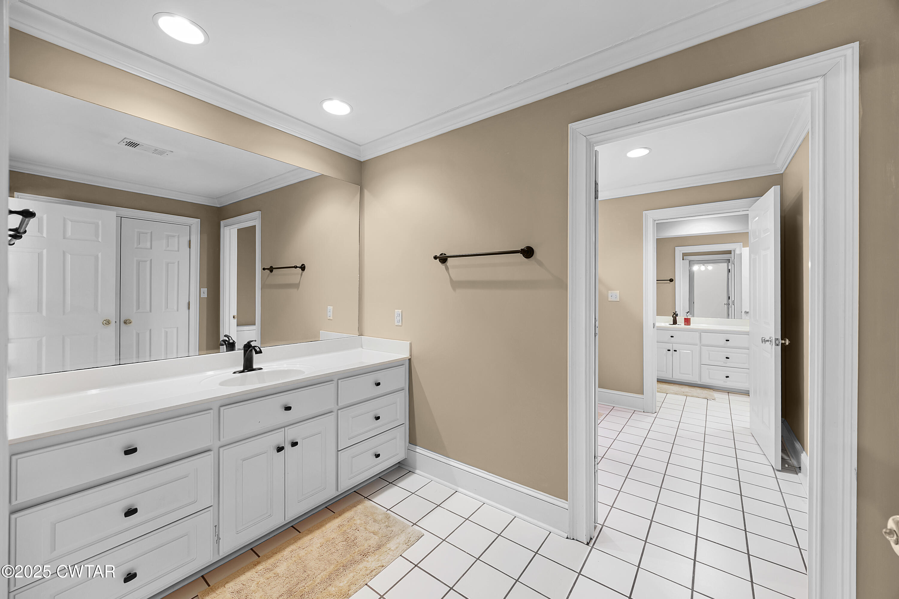 40 Winfield Place Jackson, TN 38305 - Photo 23 of 37 a spacious bathroom with a double vanity sink a mirror and a shower