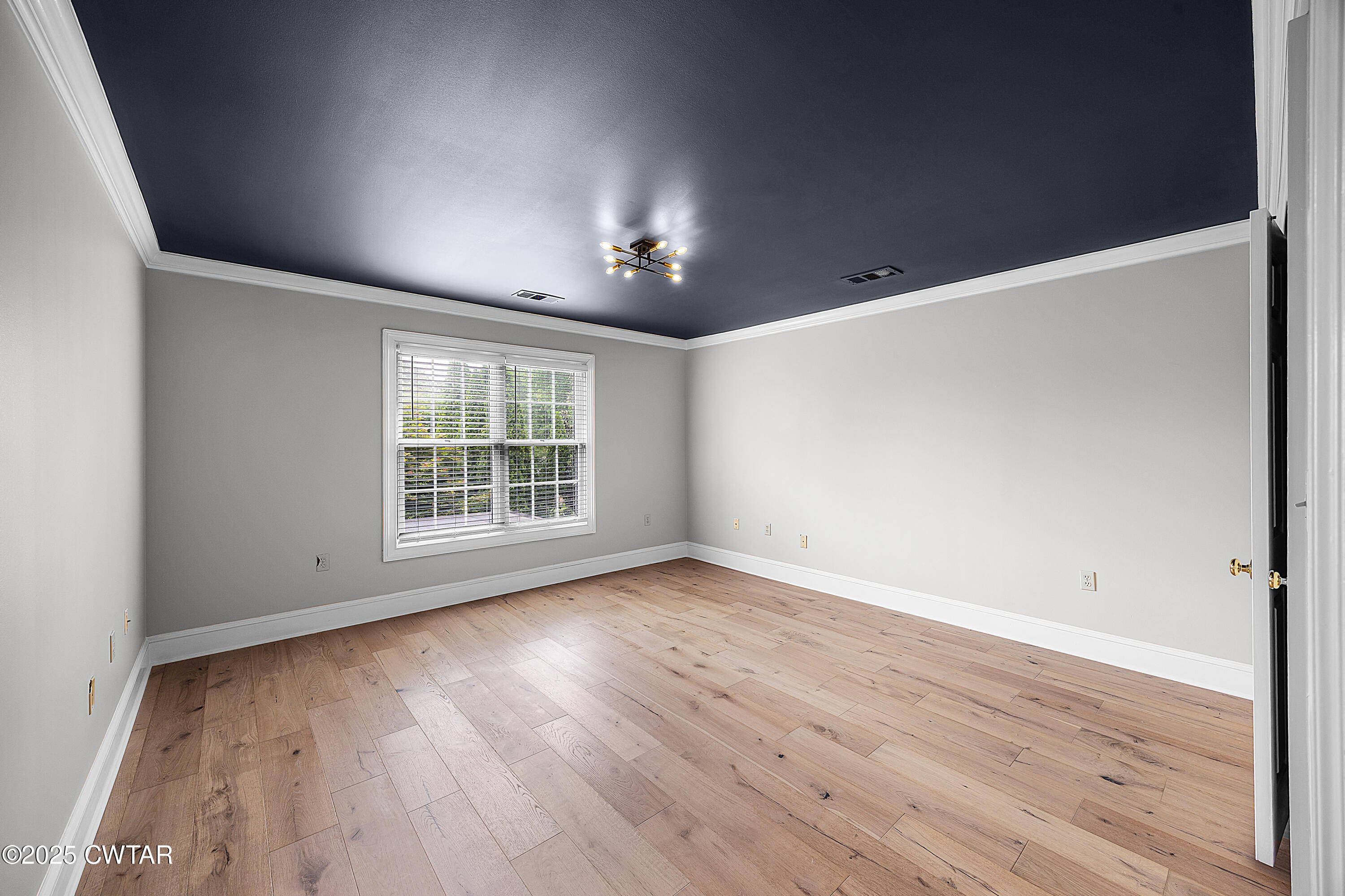 40 Winfield Place Jackson, TN 38305 - Photo 26 of 37 an empty room with wooden floor and windows