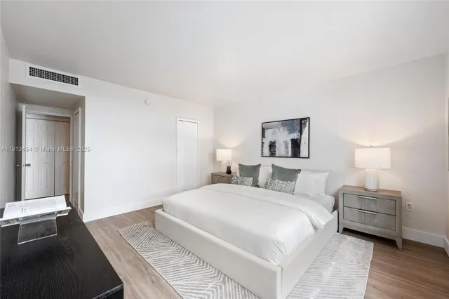 a bedroom with a bed and a night lamp