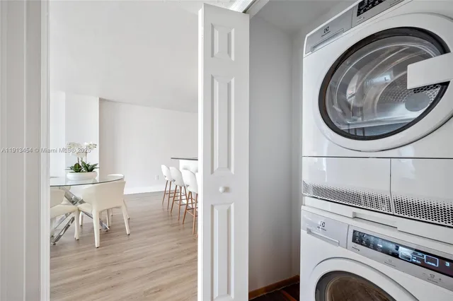 a view of a hallway with washer and dryer