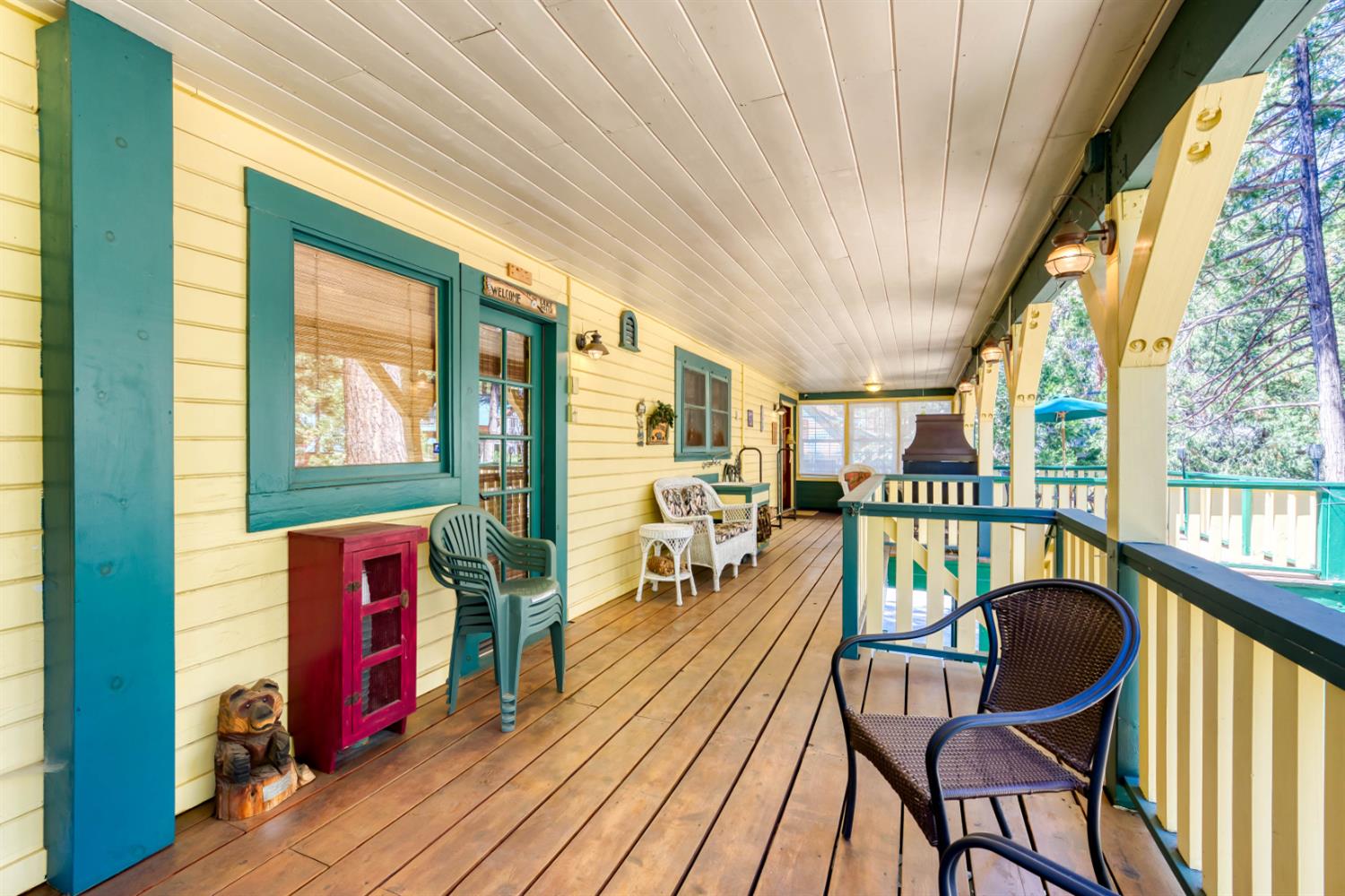 42025 Tollhouse Road Shaver Lake, CA 93664 - Photo 19 of 64 a balcony with chairs and wooden floor