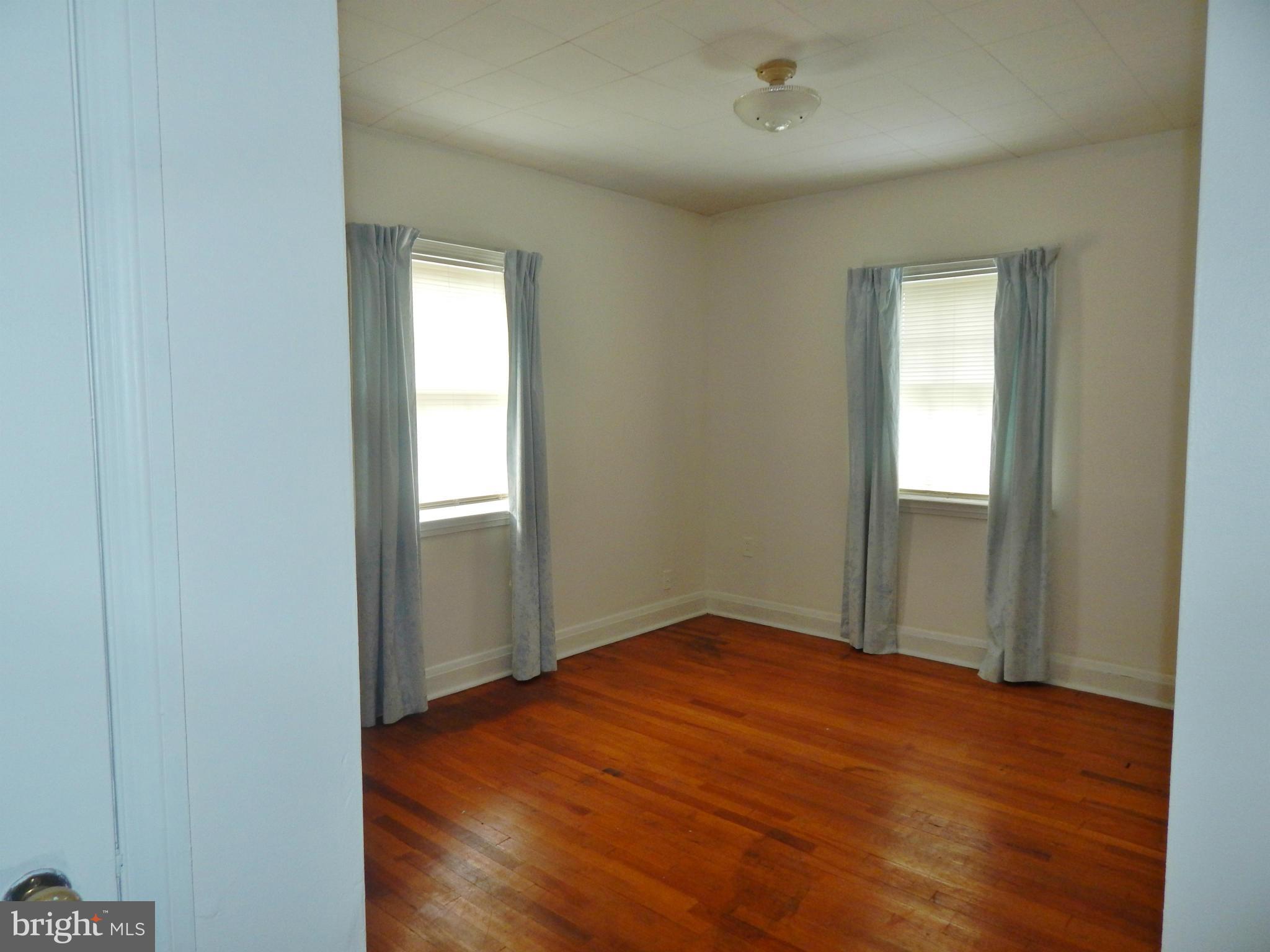 1884 Yakona Road Baltimore, MD 21234 - Photo 11 of 19 a view of empty room with wooden floor and fan