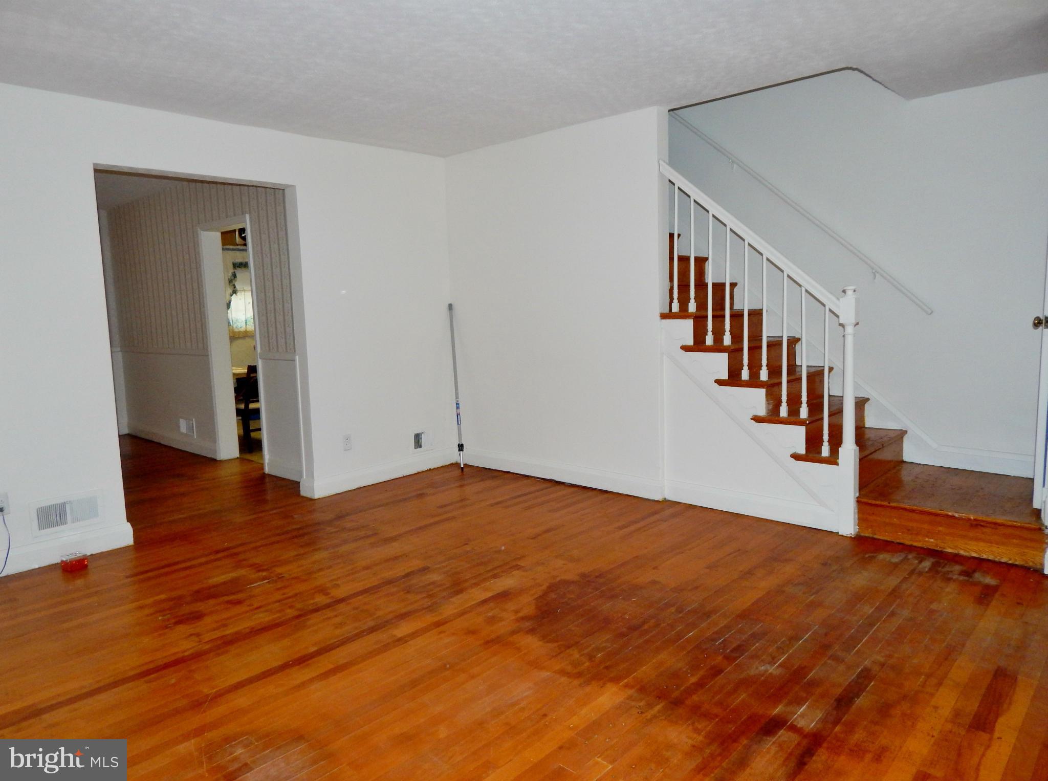 1884 Yakona Road Baltimore, MD 21234 - Photo 5 of 19 a view of an empty room with wooden floor and stairs